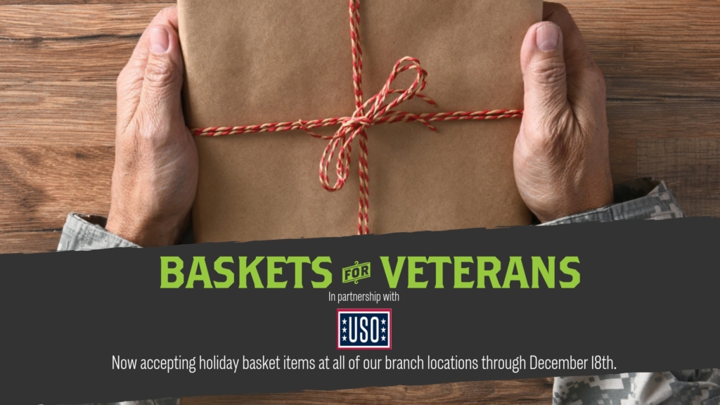 An elderly soldier's hands holding a wrapped package in a promo for Basskets for Veterans in partnership with the USO.