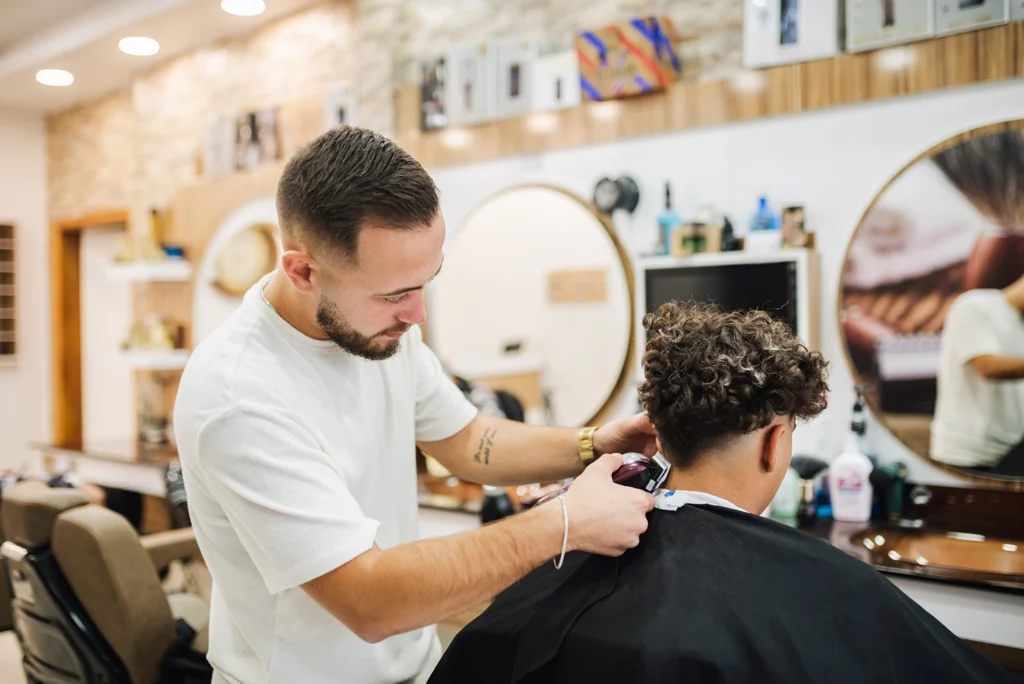 Country-Bank-man-cuts-hair-of-client-at-hair-salon