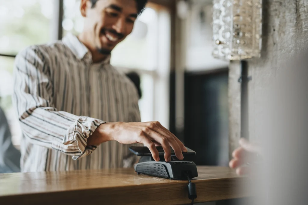 Country-Bank-man-scanning-card-at-reader