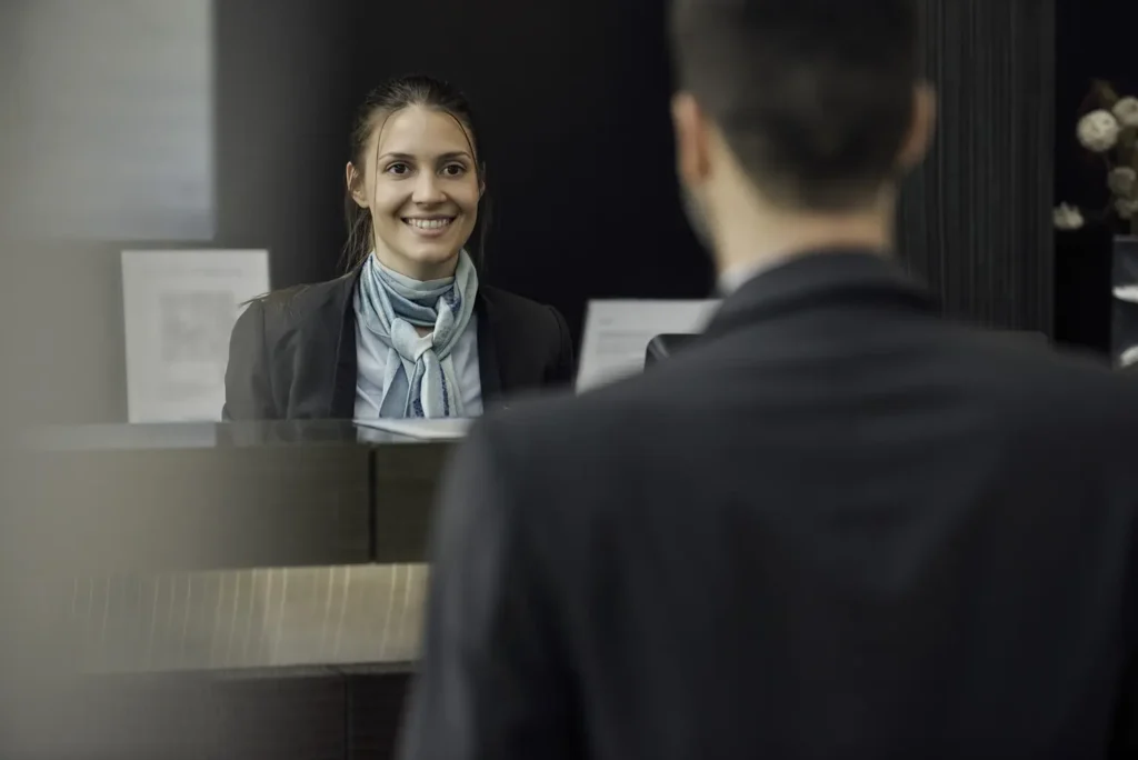 Country-Bank-office-setting-with-woman-behind-counter-and-man-in-line