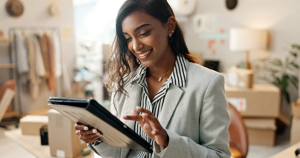 Country-Bank-professional-woman-sitting-at-office-desk-working-on-tablet-1