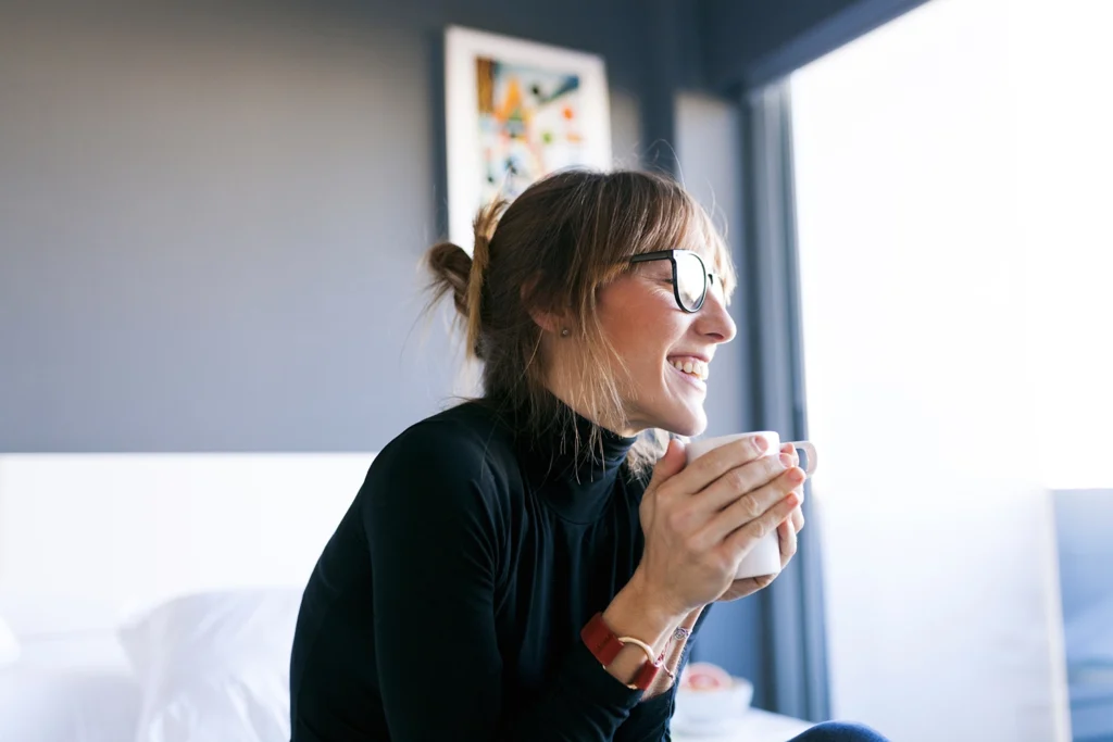 Country-Bank-woman-holding-cup-of-coffee-in-professional-setting