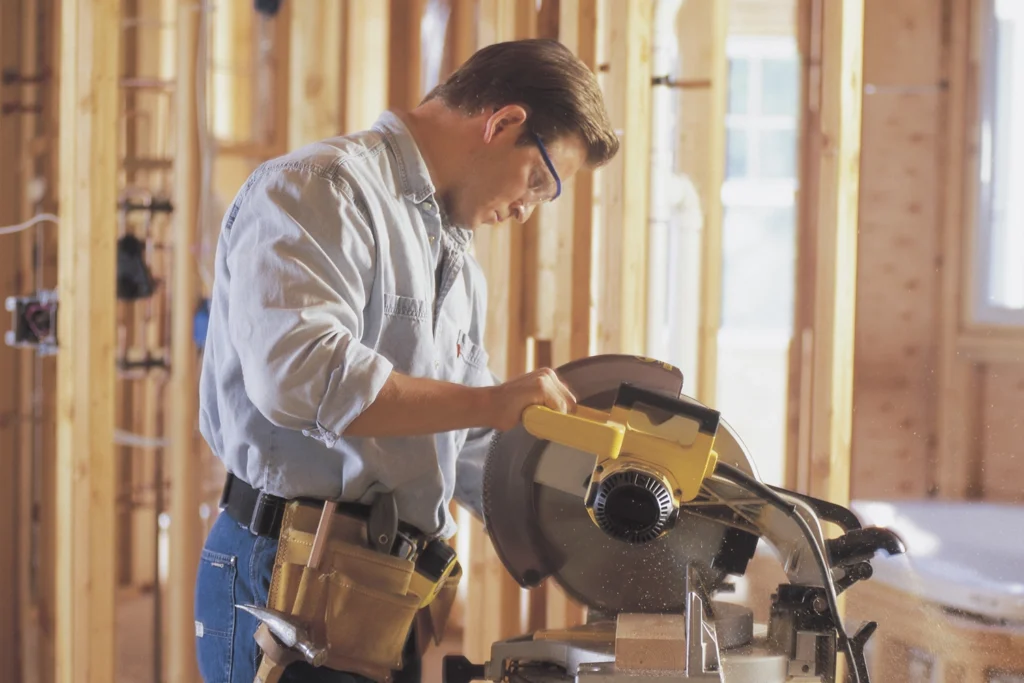 Country-Bank-Man-Cutting-With-Saw-Construction-Site-Loan