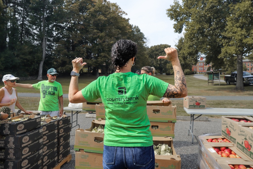 Country-Bank-Employee-Points-to-Shirt-Volunteering-Community