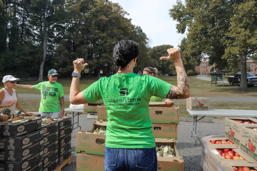 Country-Bank-Employee-Points-to-Shirt-Volunteering-Community